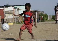 Child playing soccer